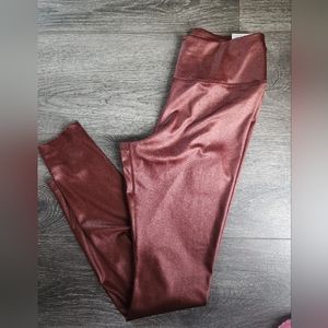 Nike Leggings size small in rust/brown color
